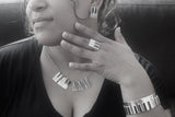 Piano earrings necklace ring and Bangle Jewelry set Sterling silver with 14kt gold music symbol accents. Moi Magazine