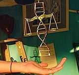 Justice Mobile Art, Metal art by Chester Allen called Due Process, consisting of DNA strand, and Scales of Justice, Art about Fairness