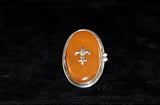 Fleur de lis Amber ring Handmade by New Orleans artist Chester Allen one of a kind in Butterscotch amber stone set in Sterling silver
