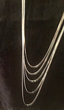 Silver chain, An accessory to add to a pendant to make a necklace. Sturdy, doesn’t tend to kink.