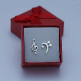 Music stud earrings, Treble and Bass Clef dainty earrings in opposite ears sterling silver handmade Chester Allen's unique music jewelry art