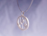 Unique handmade pendant, multi gemstone artistically crafted in hammered sterling silver