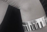 Piano Bangle Sterling silver with 14kt gold music symbol accents
