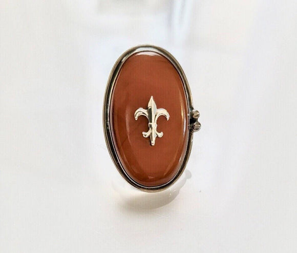 Fleur de lis Amber ring Handmade by New Orleans artist Chester Allen one of a kind in Butterscotch amber stone set in Sterling silver