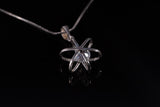 Dimensional atom pendant in sterling silver with crystal center, includes a silver chain,