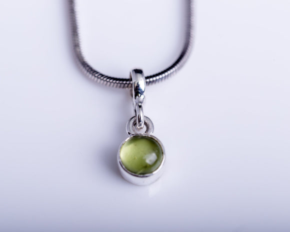 Peridot charm necklace, sterling silver, green circle pendant, September birthstone